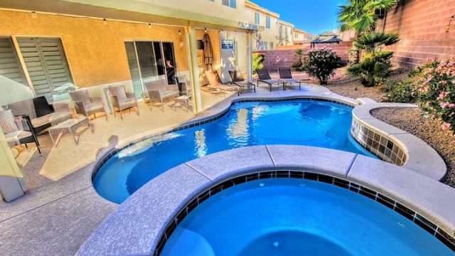 big blue swimming pool at the Desert Rancho Mirage